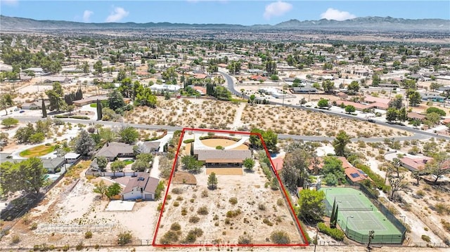 19428 Shasta Rd, Apple Valley, CA 92307 - aerial view of residential area with property parcel outlined and a mountainous background