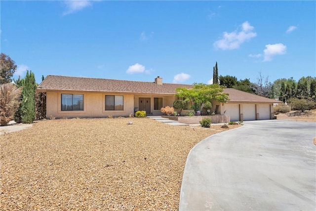 19428 Shasta Rd, Apple Valley, CA 92307 - single story home featuring a garage, concrete driveway, and a chimney