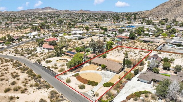 19428 Shasta Rd, Apple Valley, CA 92307 - aerial view of residential area featuring a mountain backdrop and property parcel outlined