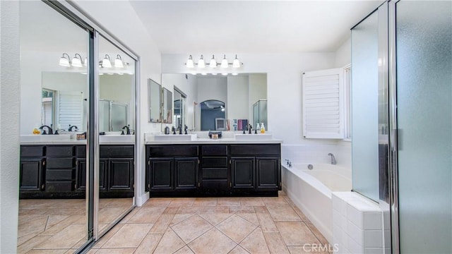 18223 Shannon Ridge Pl, Canyon Country, CA 91387 - bathroom with double vanity, a garden tub, and a shower with door