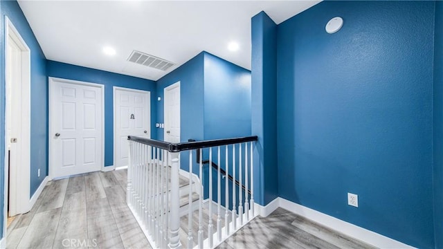 18223 Shannon Ridge Pl, Canyon Country, CA 91387 - corridor with an upstairs landing, wood finished floors, and recessed lighting