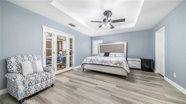 18223 Shannon Ridge Pl, Canyon Country, CA 91387 - bedroom with a raised ceiling, french doors, wood finished floors, and ceiling fan