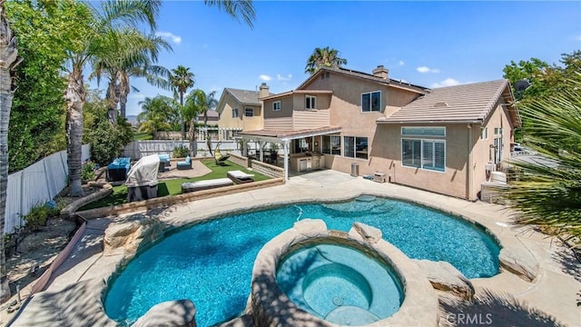 18223 Shannon Ridge Pl, Canyon Country, CA 91387 - view of swimming pool with a fenced backyard, a pool with connected hot tub, and a patio
