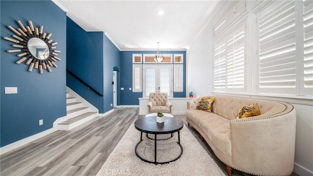 18223 Shannon Ridge Pl, Canyon Country, CA 91387 - living area featuring stairs, wood finished floors, french doors, ornamental molding, and arched walkways