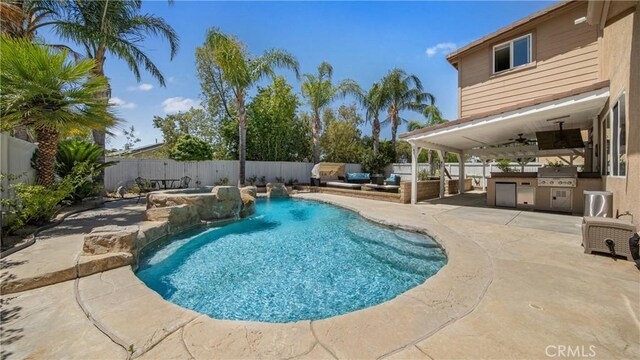 18223 Shannon Ridge Pl, Canyon Country, CA 91387 - view of swimming pool with area for grilling, a fenced backyard, ceiling fan, a patio, and an in-ground hot tub