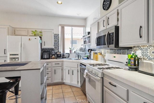 26853 Summer Sunshine Dr, Menifee, CA 92585 - kitchen with stainless steel appliances, tasteful backsplash, recessed lighting, light tile patterned floors, and a breakfast bar