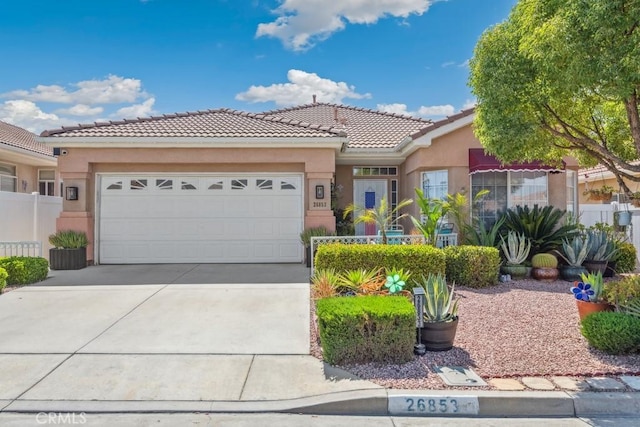 26853 Summer Sunshine Dr, Menifee, CA 92585 - view of front of home with stucco siding, a tiled roof, a garage, and concrete driveway