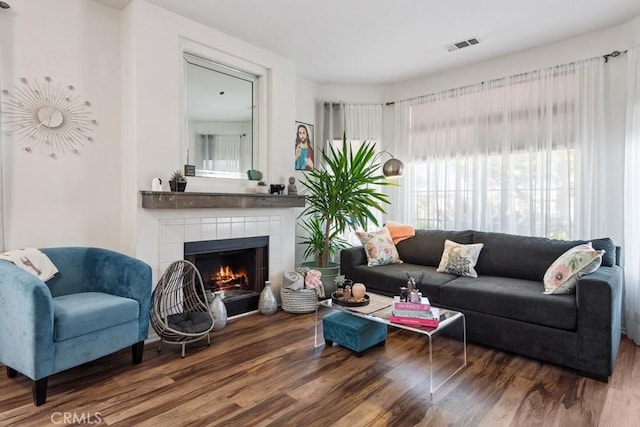 26853 Summer Sunshine Dr, Menifee, CA 92585 - living area featuring wood finished floors and a tile fireplace