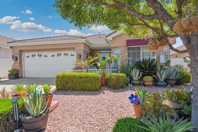 26853 Summer Sunshine Dr, Menifee, CA 92585 - view of front facade with an attached garage, driveway, stucco siding, and a tiled roof