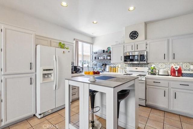 26853 Summer Sunshine Dr, Menifee, CA 92585 - kitchen with white appliances, tasteful backsplash, tile countertops, light tile patterned floors, and recessed lighting