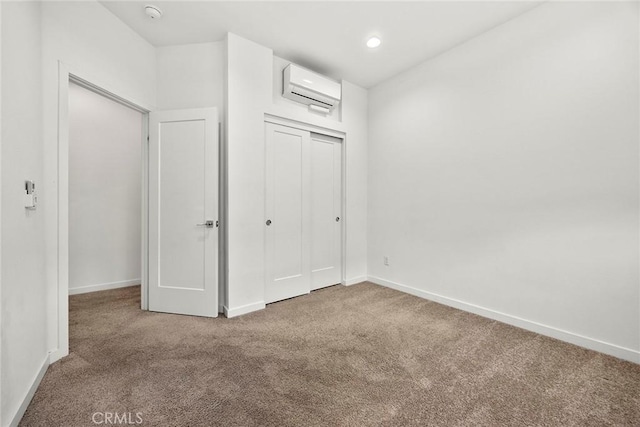 426 W Central Ave, Brea, CA 92821 - unfurnished bedroom with a wall unit AC, carpet floors, and a closet