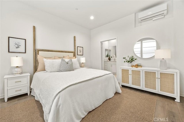 426 W Central Ave, Brea, CA 92821 - bedroom with an AC wall unit, wood finished floors, ensuite bath, and recessed lighting