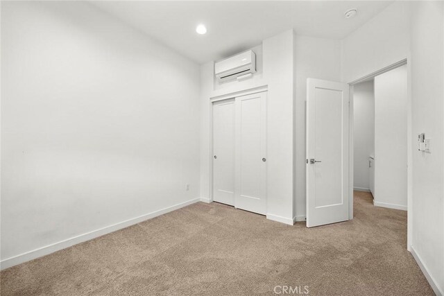 426 W Central Ave, Brea, CA 92821 - unfurnished bedroom with an AC wall unit, carpet floors, a closet, and recessed lighting