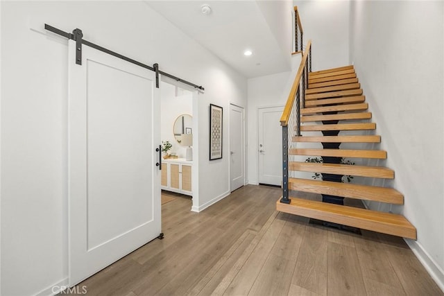 426 W Central Ave, Brea, CA 92821 - staircase featuring a barn door, wood finished floors, and recessed lighting