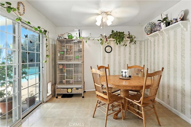2997 June Ct, Merced, CA 95348 - dining area with a ceiling fan, light tile patterned flooring, and wallpapered walls