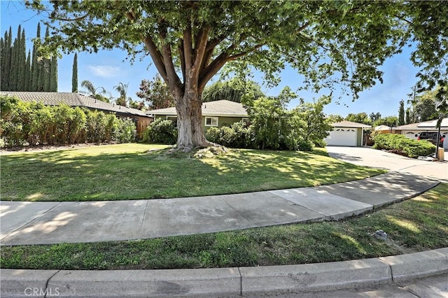 2997 June Ct, Merced, CA 95348 - view of front of house featuring driveway, a garage, and a front yard