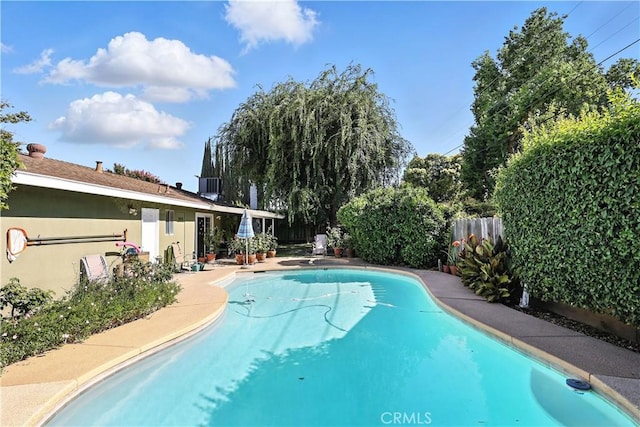 2997 June Ct, Merced, CA 95348 - view of swimming pool featuring a fenced backyard