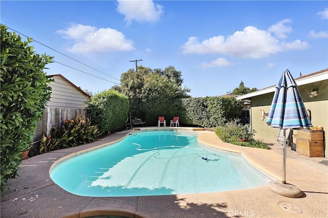 2997 June Ct, Merced, CA 95348 - view of swimming pool with a fenced backyard and a patio area