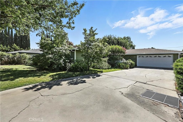 2997 June Ct, Merced, CA 95348 - view of front of property with driveway, a front lawn, and an attached garage