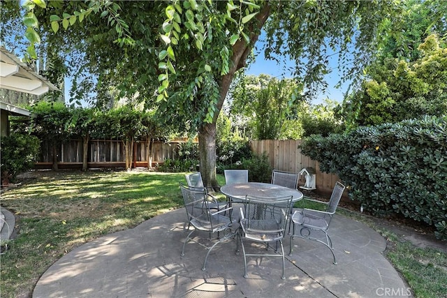 2997 June Ct, Merced, CA 95348 - fenced backyard featuring a patio area and outdoor dining area
