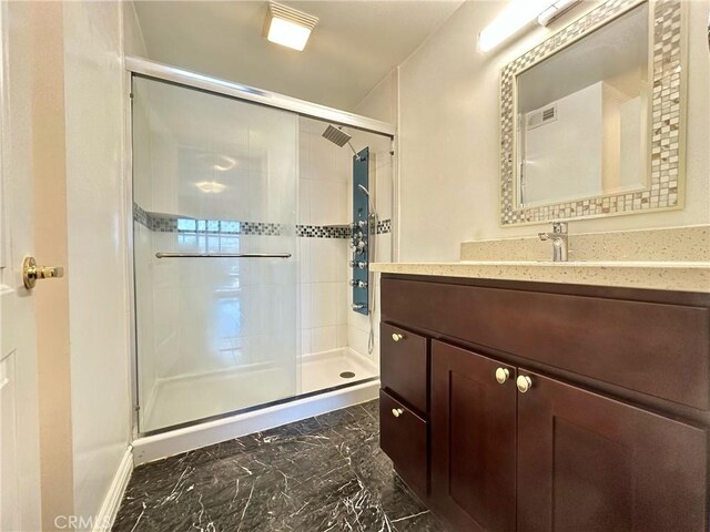 1602 Via Palermo, Montebello, CA 90640 - bathroom with marble finish floors, vanity, and a shower stall
