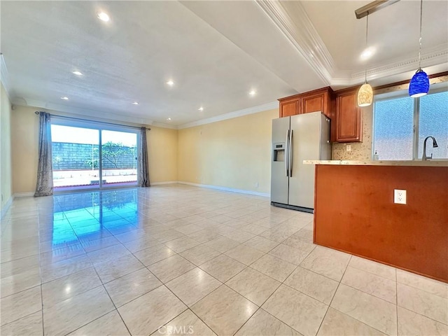 1602 Via Palermo, Montebello, CA 90640 - kitchen featuring stainless steel fridge, light tile patterned floors, crown molding, brown cabinetry, and decorative light fixtures