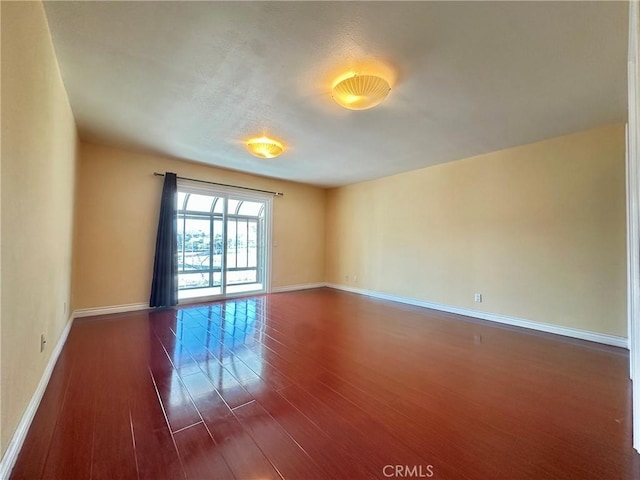 1602 Via Palermo, Montebello, CA 90640 - unfurnished room with baseboards and dark wood finished floors