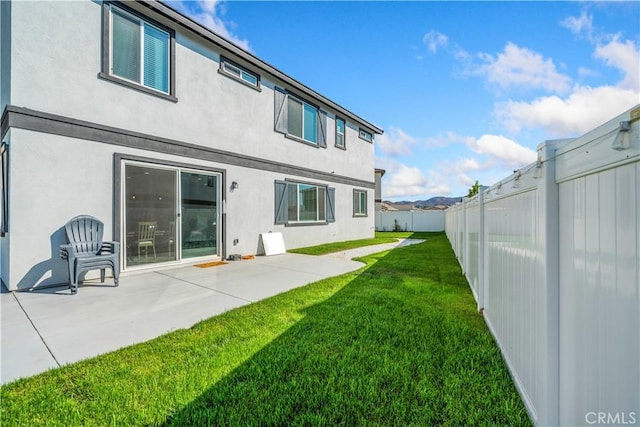36300 Firelight Cir, Wildomar, CA 92595 - back of house with stucco siding, a fenced backyard, and a patio area