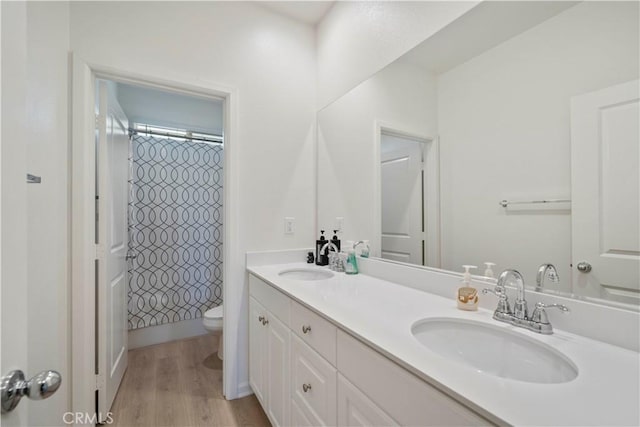 36300 Firelight Cir, Wildomar, CA 92595 - bathroom with double vanity, curtained shower, and wood finished floors