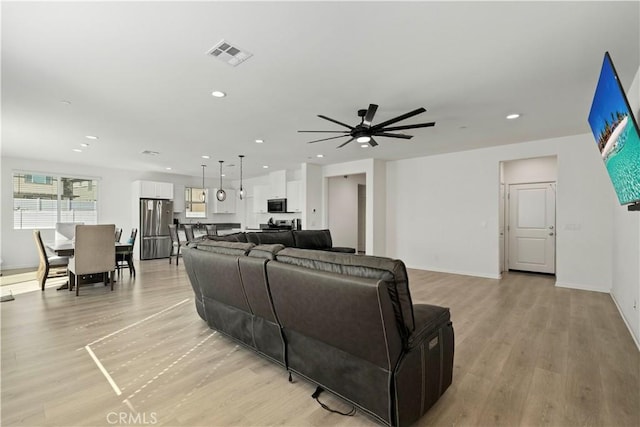 36300 Firelight Cir, Wildomar, CA 92595 - living room featuring light wood finished floors, recessed lighting, and a ceiling fan