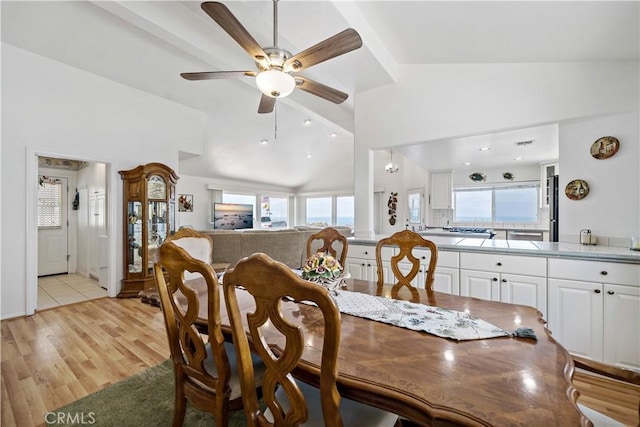 6536 Oceanview Dr Unit T, Carlsbad, CA 92011 - dining room featuring light wood-style floors, ceiling fan, and high vaulted ceiling