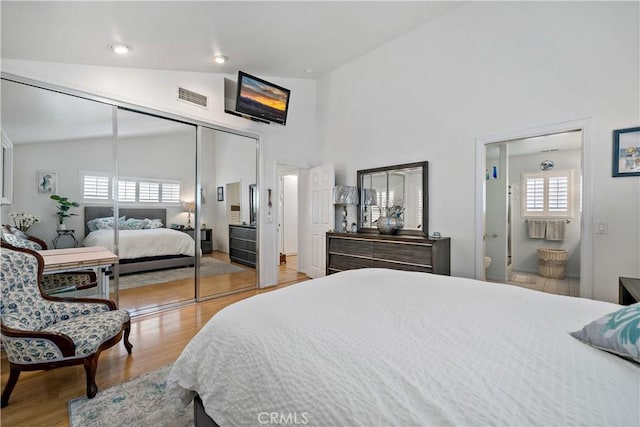 6536 Oceanview Dr Unit T, Carlsbad, CA 92011 - bedroom featuring wood finished floors, high vaulted ceiling, and a closet