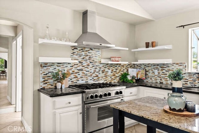 2915 Kennedy Ave Unit A & B, Chico, CA 95973 - kitchen with high end stainless steel range oven, open shelves, wall chimney exhaust hood, light tile patterned floors, and plenty of natural light