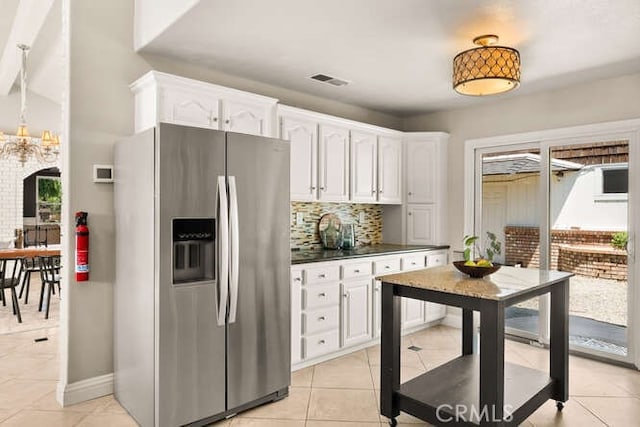 2915 Kennedy Ave Unit A & B, Chico, CA 95973 - kitchen with stainless steel refrigerator with ice dispenser, plenty of natural light, backsplash, and white cabinets