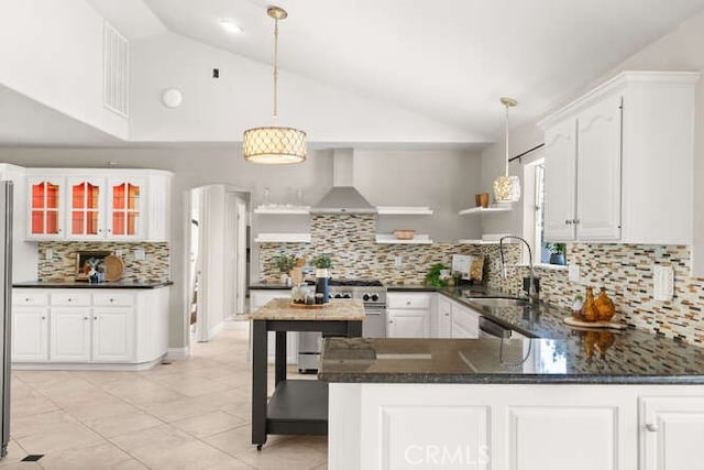 2915 Kennedy Ave Unit A & B, Chico, CA 95973 - kitchen featuring wall chimney exhaust hood, appliances with stainless steel finishes, tasteful backsplash, light tile patterned floors, and white cabinetry