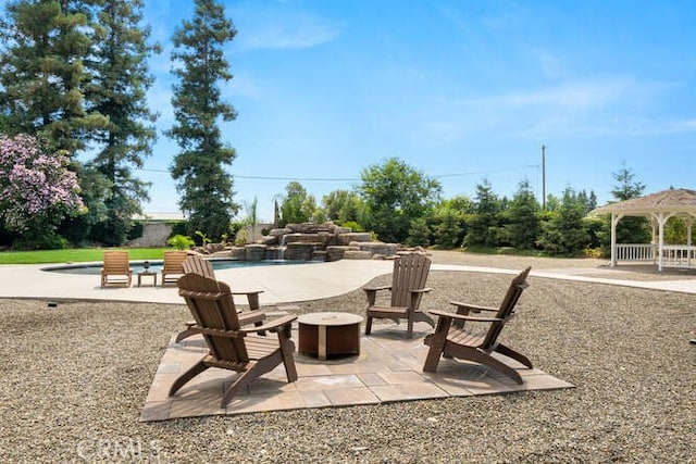 2915 Kennedy Ave Unit A & B, Chico, CA 95973 - view of patio / terrace with a fire pit, an outdoor pool, and a gazebo