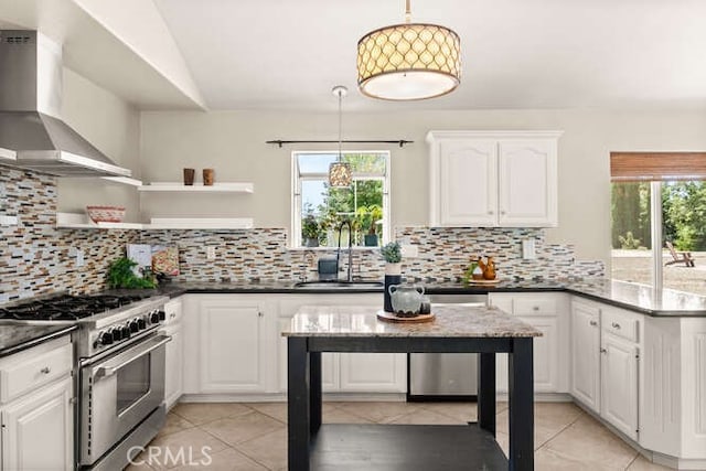2915 Kennedy Ave Unit A & B, Chico, CA 95973 - kitchen featuring appliances with stainless steel finishes, open shelves, wall chimney range hood, light tile patterned floors, and plenty of natural light
