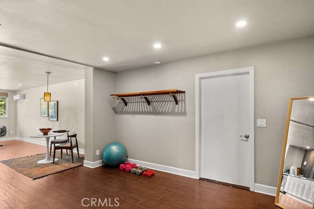 2915 Kennedy Ave Unit A & B, Chico, CA 95973 - exercise room featuring wood finished floors, a wall mounted air conditioner, and recessed lighting
