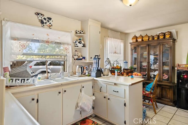 2915 Kennedy Ave Unit A & B, Chico, CA 95973 - kitchen with light tile patterned floors, light countertops, white cabinetry, a peninsula, and open shelves