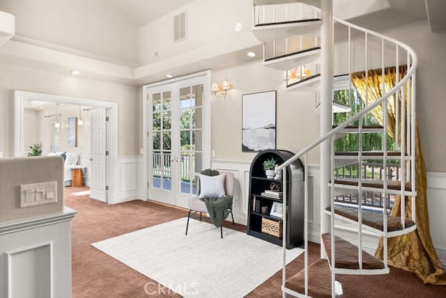 2915 Kennedy Ave Unit A & B, Chico, CA 95973 - sitting room with french doors, plenty of natural light, wainscoting, carpet flooring, and a decorative wall