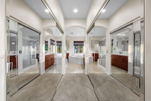 1033 Goldeneye, Carlsbad, CA 92011 - interior space featuring two vanities, a stall shower, a freestanding tub, and recessed lighting