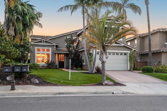 1033 Goldeneye, Carlsbad, CA 92011 - view of front of house with a tile roof, concrete driveway, a front lawn, stucco siding, and a garage