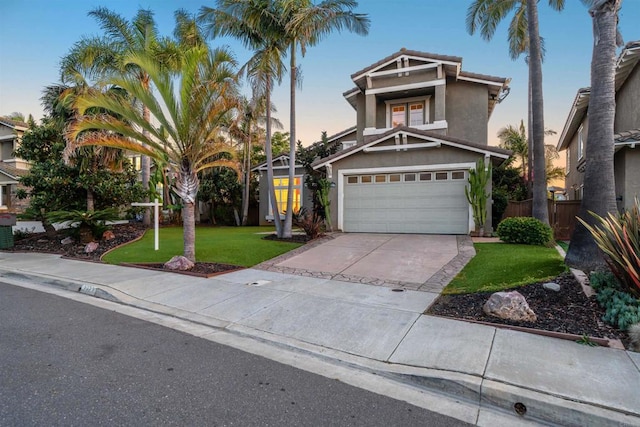 1033 Goldeneye, Carlsbad, CA 92011 - view of front of house with stucco siding, concrete driveway, and a garage