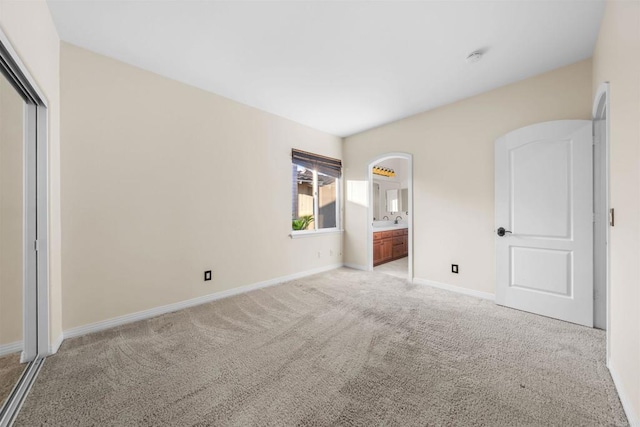 1033 Goldeneye, Carlsbad, CA 92011 - unfurnished bedroom featuring light carpet, connected bathroom, and a closet
