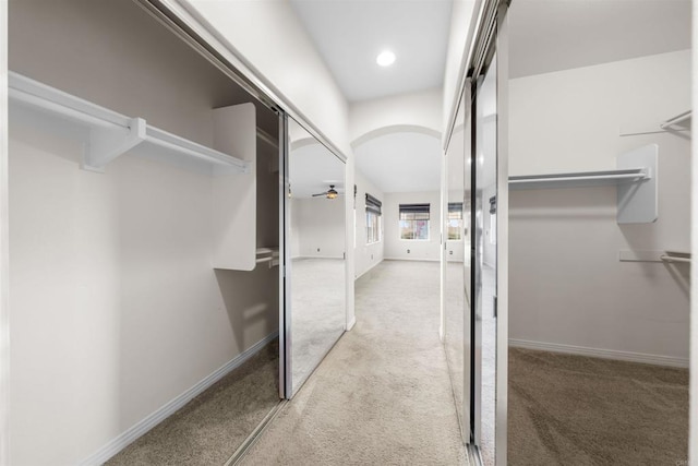 1033 Goldeneye, Carlsbad, CA 92011 - walk in closet with light colored carpet and ceiling fan