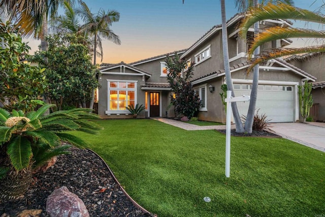 1033 Goldeneye, Carlsbad, CA 92011 - view of front of property with stucco siding, driveway, a front yard, a tiled roof, and an attached garage