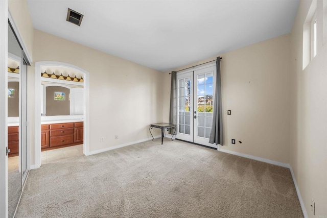 1033 Goldeneye, Carlsbad, CA 92011 - spare room featuring light carpet and french doors
