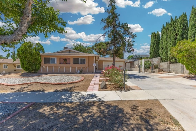 16257 Avalon Ave, Victorville, CA 92395 - view of front facade featuring concrete driveway, stucco siding, and an attached garage
