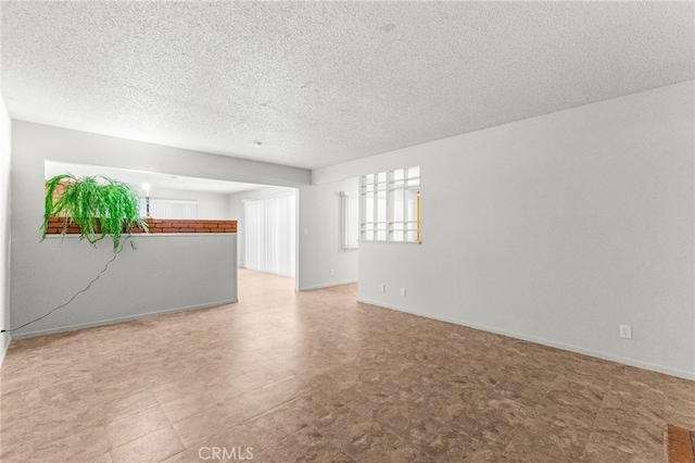 16257 Avalon Ave, Victorville, CA 92395 - unfurnished room featuring a textured ceiling