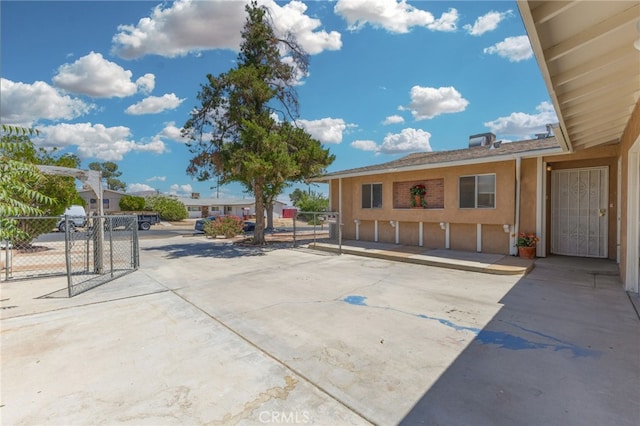 16257 Avalon Ave, Victorville, CA 92395 - view of parking / parking lot with a gate
